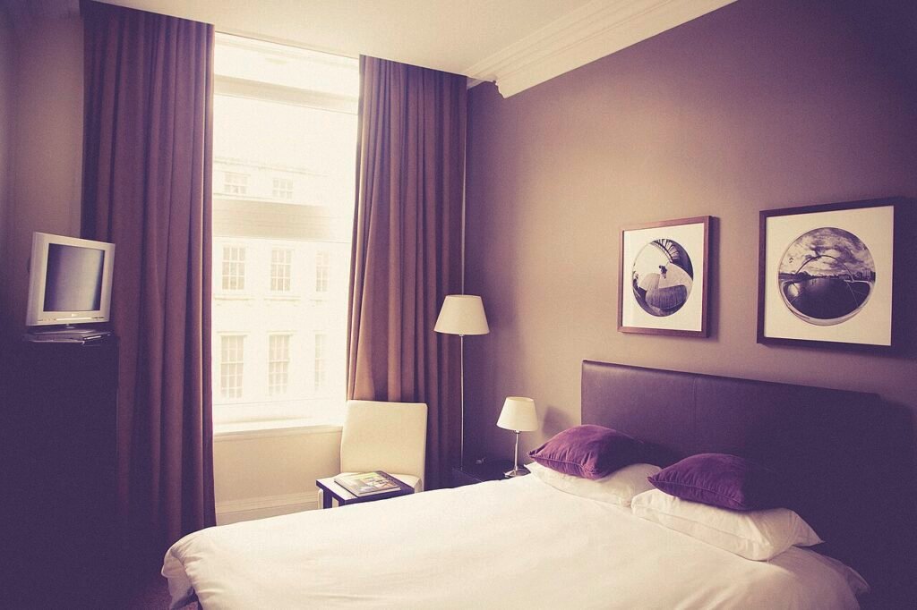 Comfortable bed in a bright bedroom